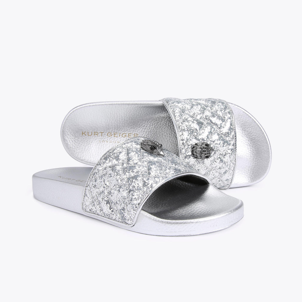 Meena Eagle Slide Sandals in Metallic Finish